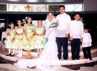 Danny and Joy with the flower girls and ring and coin bearers