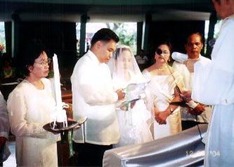 Our exchange of vows beside our parents and principal sponsors